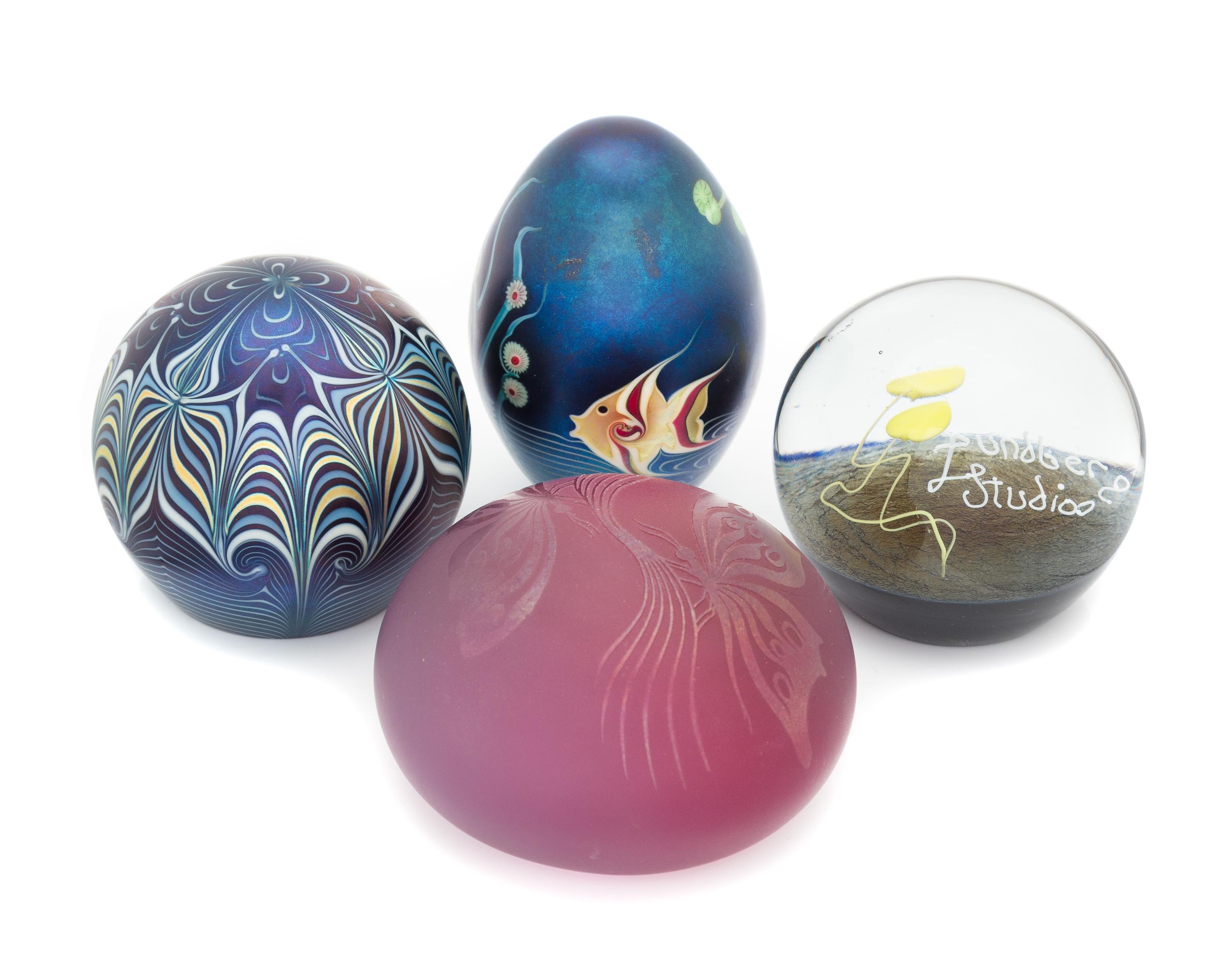 Four Iridescent Glass Paperweights Diameter of largest 3 1/2 inches