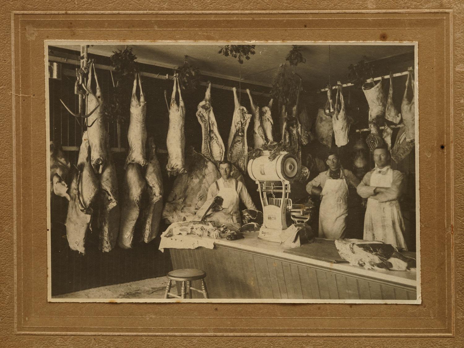 Nine Photographs Depicting Storefronts and Various Interiors