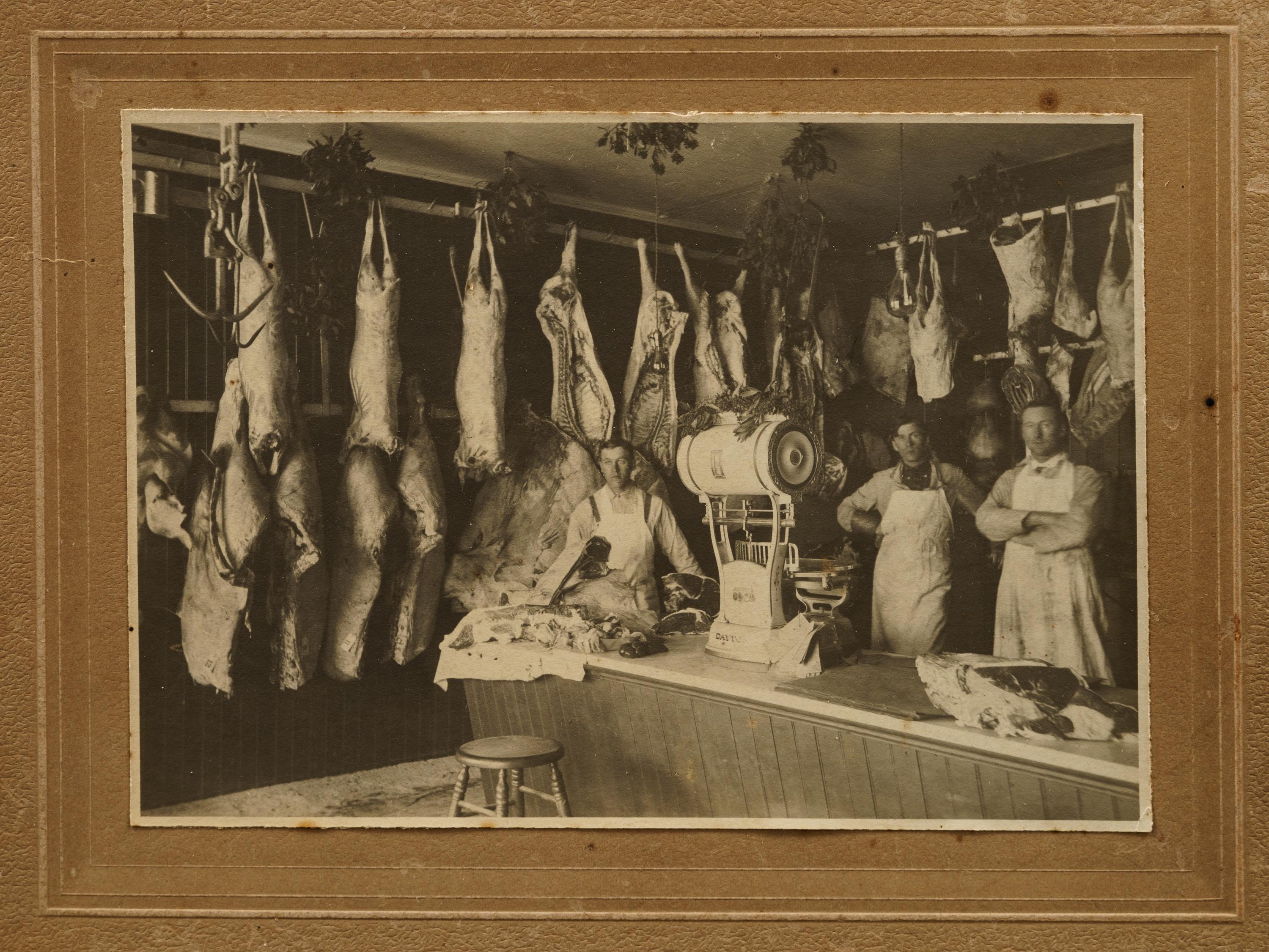 Nine Photographs Depicting Storefronts and Various Interiors