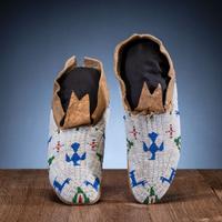 Cheyenne Beaded Buffalo Hide Moccasins, with Thunderbirds and Deer