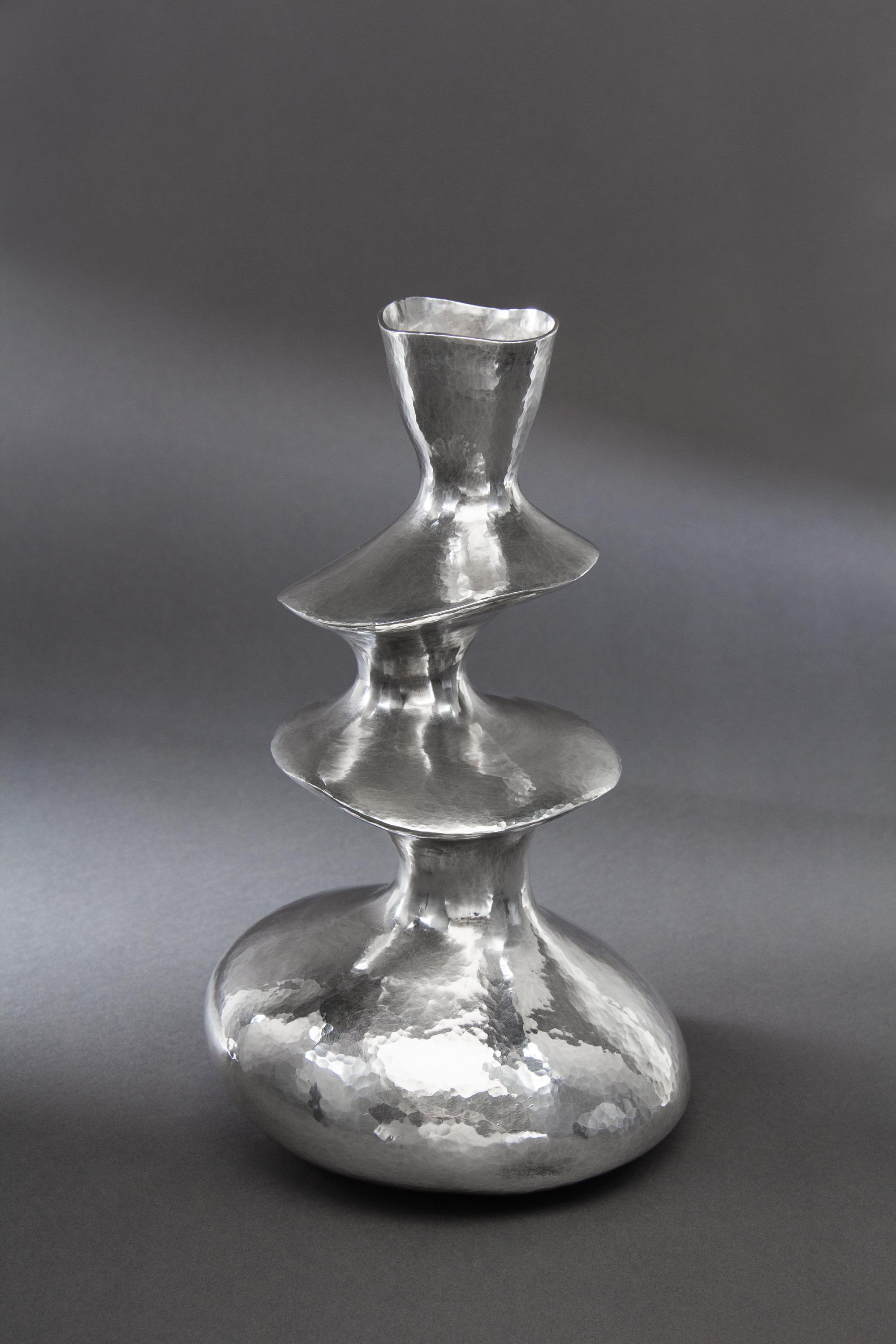 A Contemporary English Silver Vase, Hiroshi Suzuki, Sheffield, 2002, of three tiered from with a spot-hammered finish throughout.