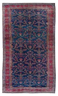 A Sarouk Wool Rug 16 feet 11 inches x 8 feet 10 inches.