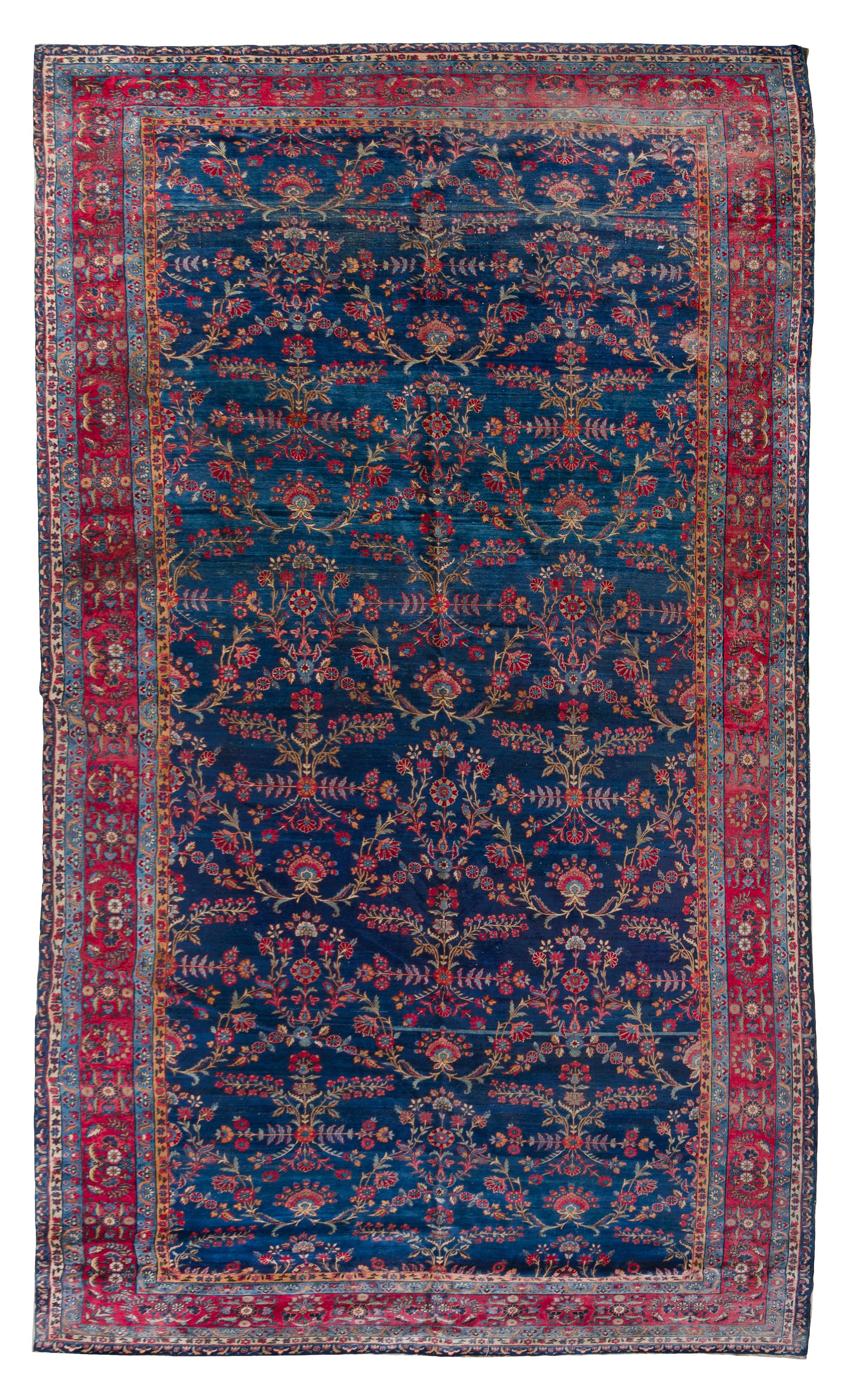 A Sarouk Wool Rug 16 feet 11 inches x 8 feet 10 inches.