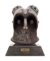 A Bamileke Carved Wood Helmet Mask