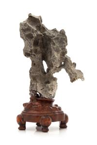 A Chinese Ying Scholar's Rock Height overall 8 inches. — 20TH CENTURY
