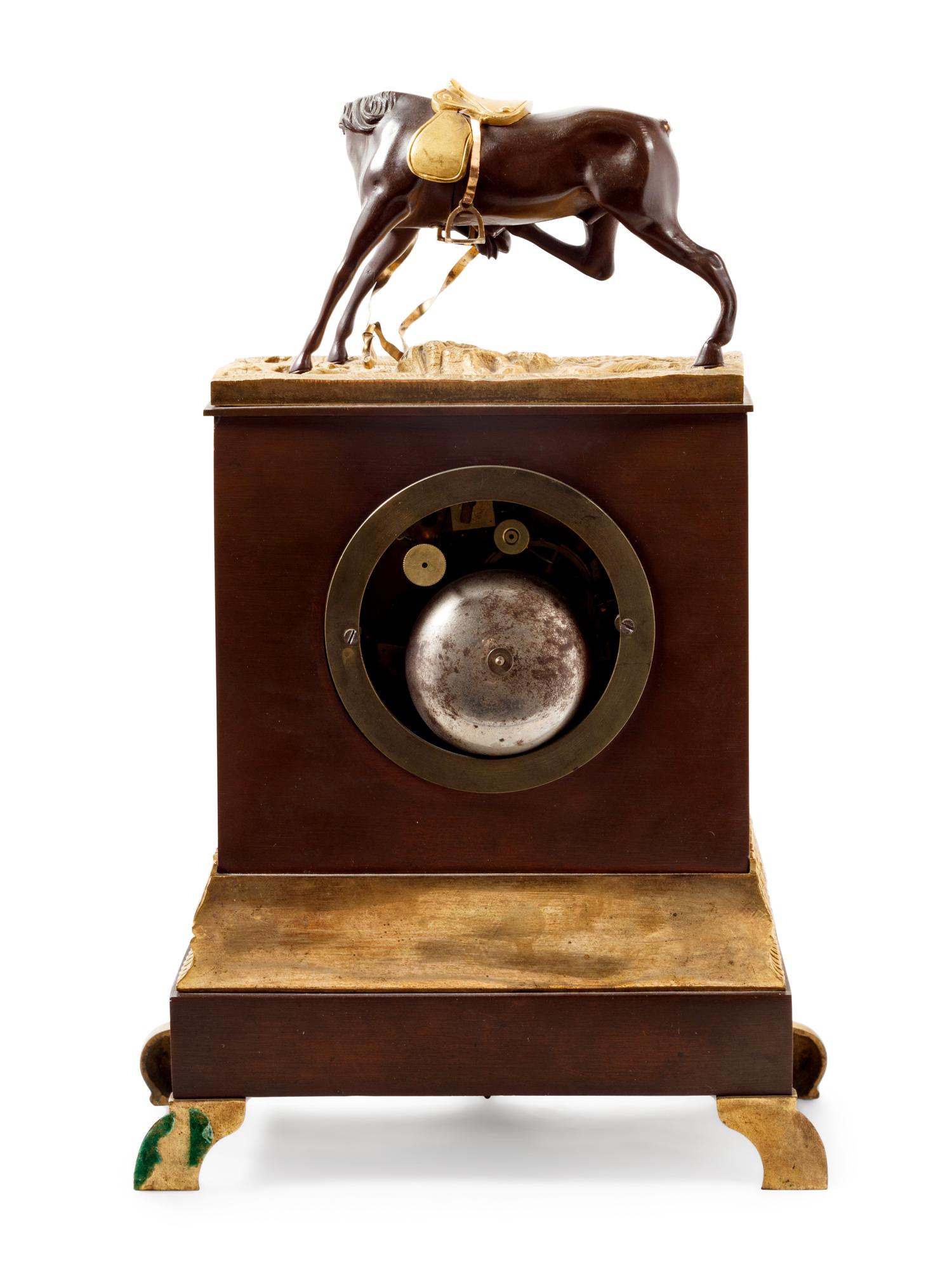An Empire Style Gilt and Patinated Bronze Mantel Clock