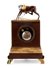 An Empire Style Gilt and Patinated Bronze Mantel Clock