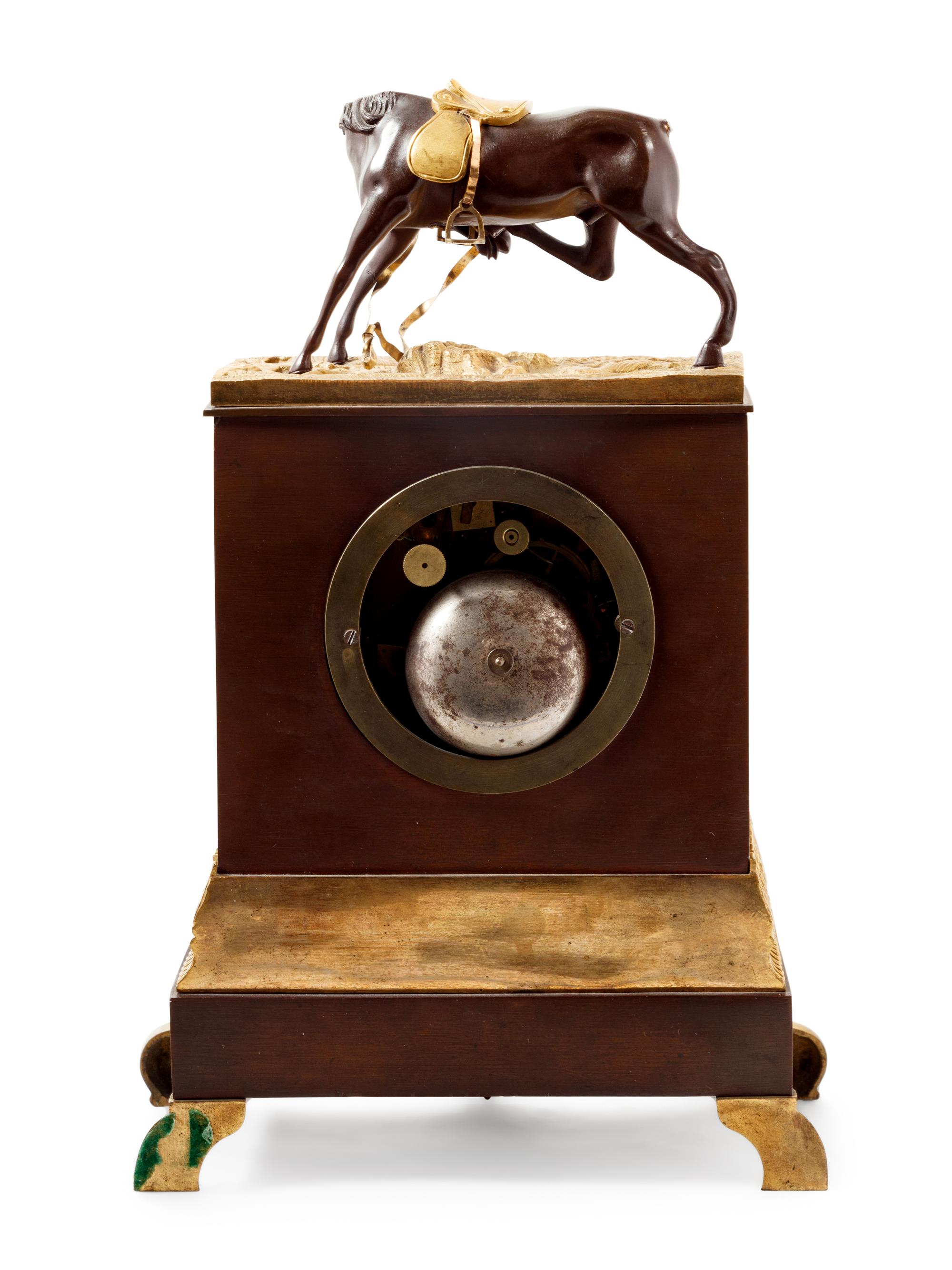 An Empire Style Gilt and Patinated Bronze Mantel Clock