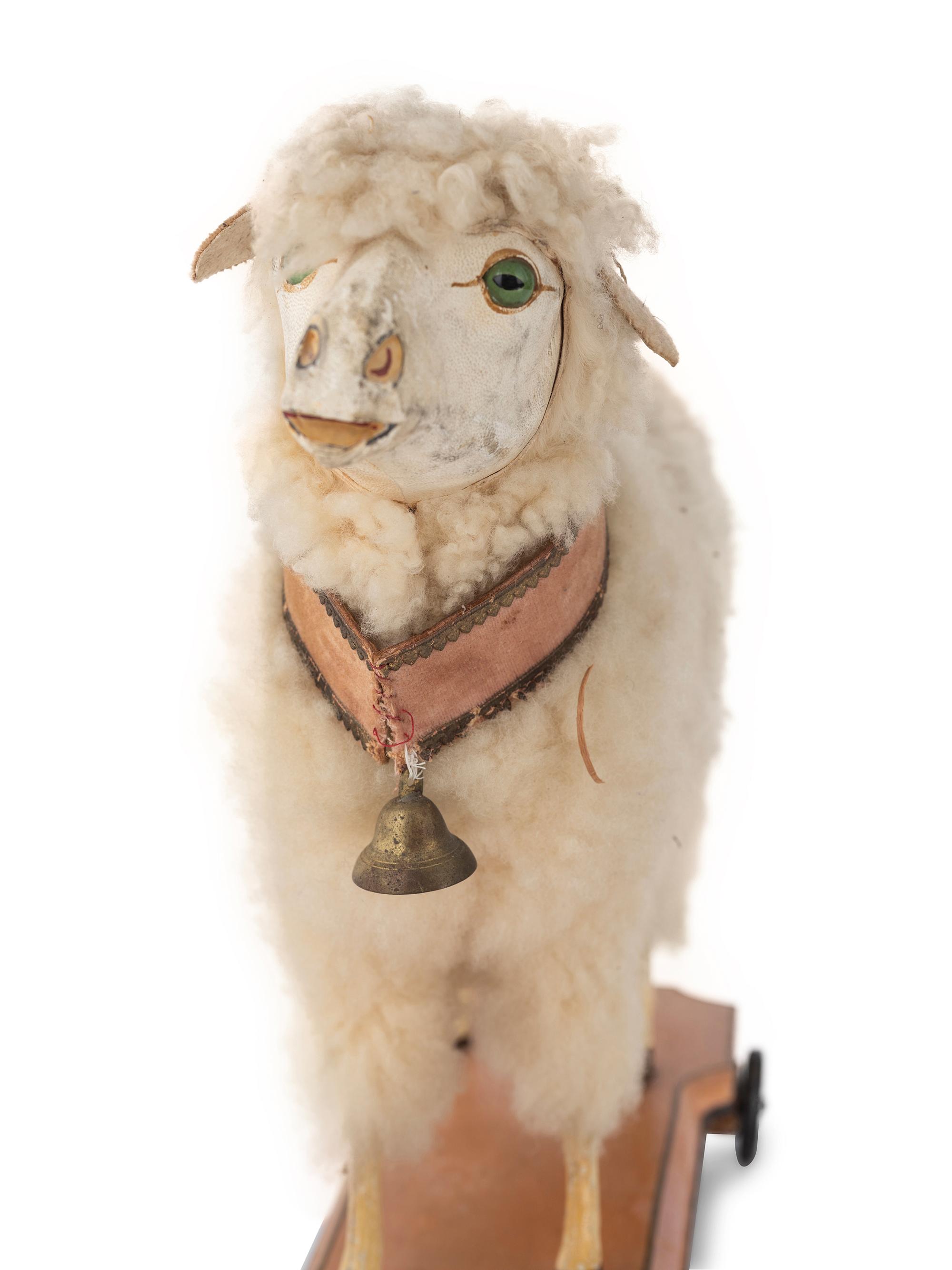 A Small Leather, Wool and Glass Inset Vocal Sheep Pull Toy