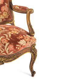 A Louis XV Style Carved and Parcel Gilt Walnut Fauteuil