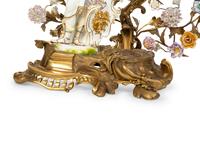 A Continental Gilt Bronze and Porcelain Figural Mantel Clock