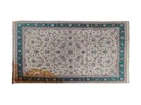 A White and Green Tabriz Rug