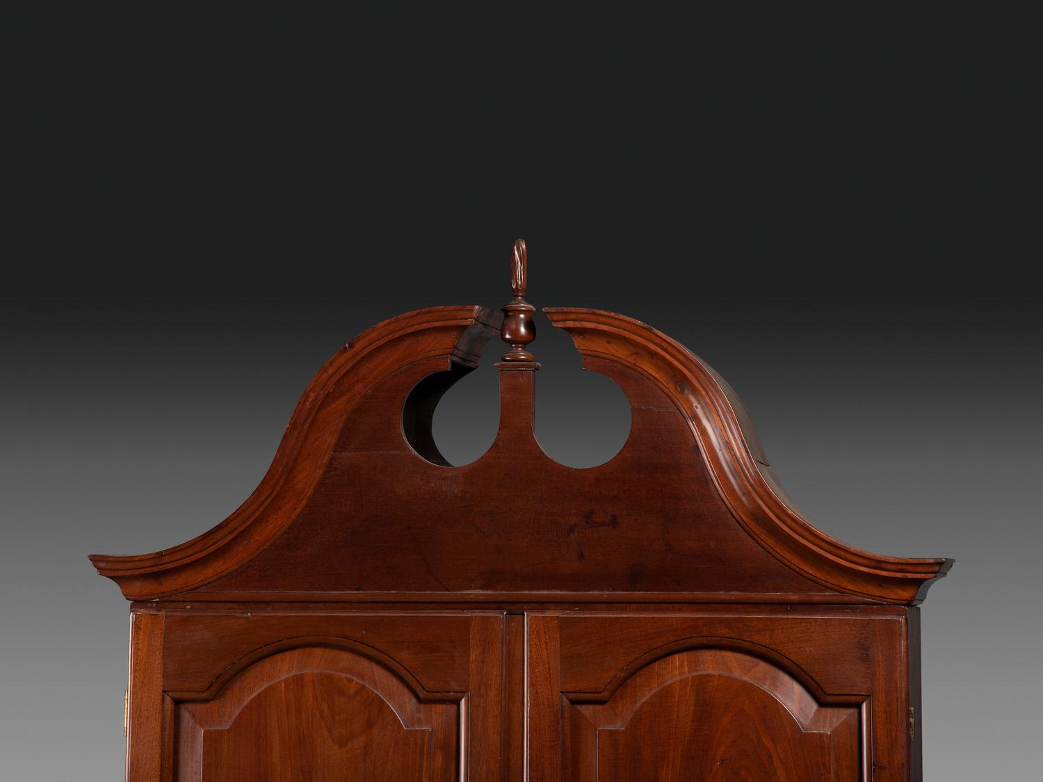 A Chippendale Figured Mahogany Bonnet Top Desk-and-Bookcase