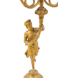 A Pair of French Gilt Bronze Figural Three-Light Candelabra