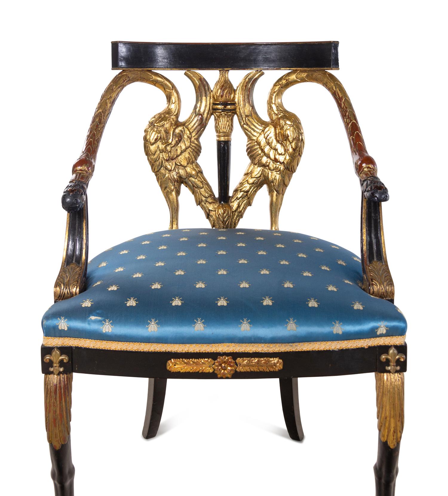 Two Empire Style Parcel Gilt Ebonized Armchairs