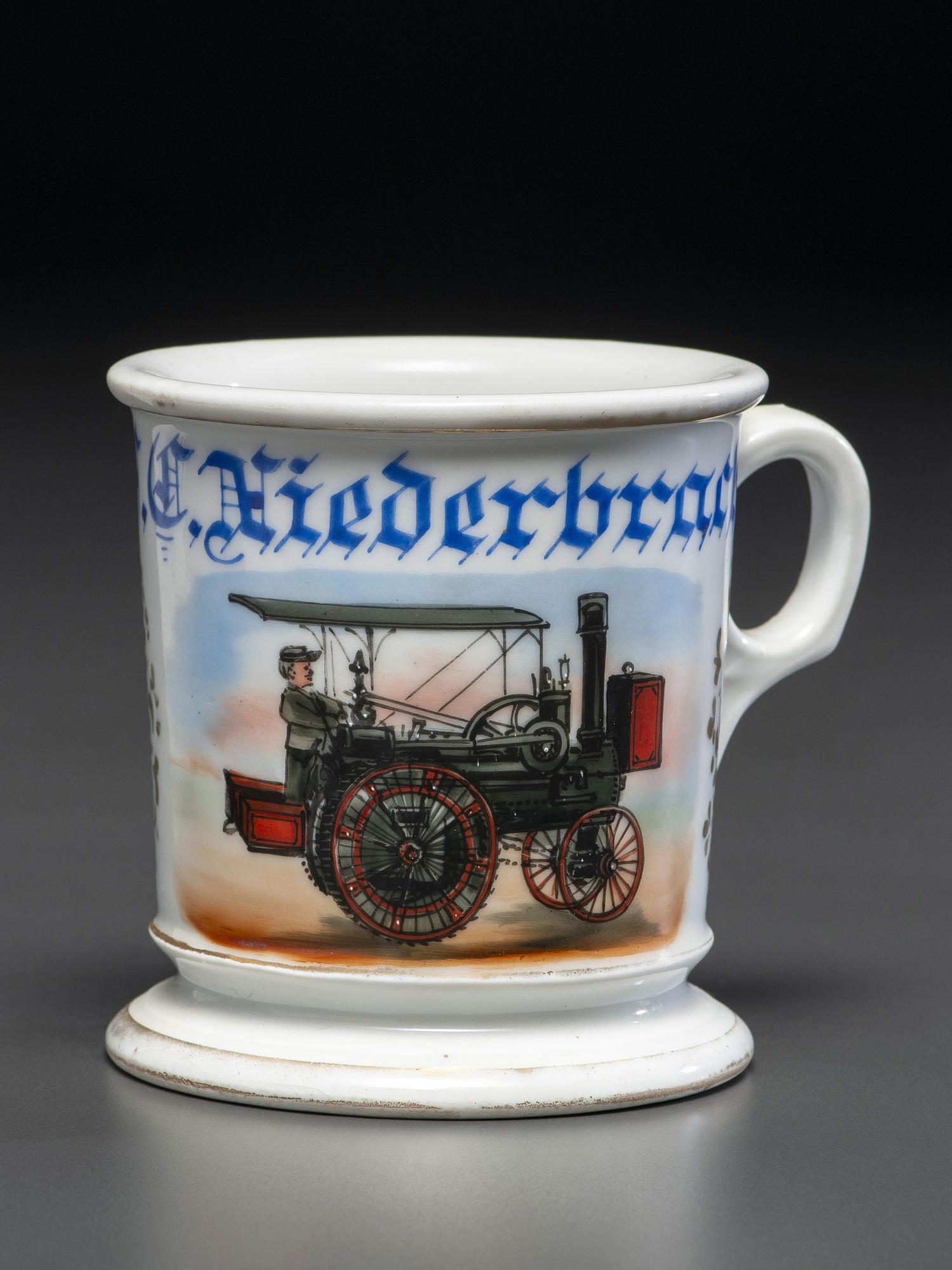 A Porcelain Shaving Mug Depicting a Steam-Powered Tractor
