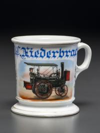 A Porcelain Shaving Mug Depicting a Steam-Powered Tractor