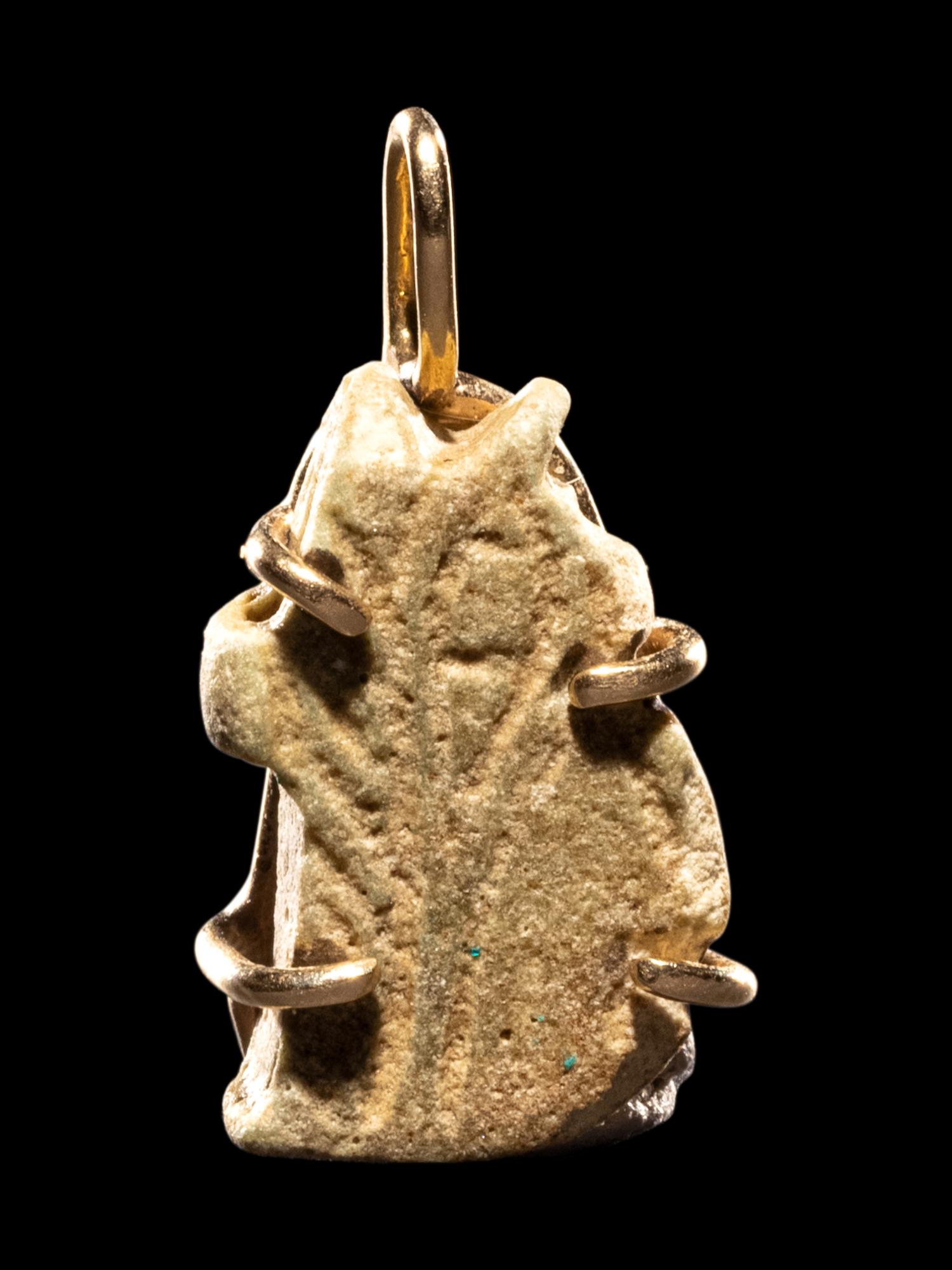 An Egyptian Faience Wadjet Eye Pendant