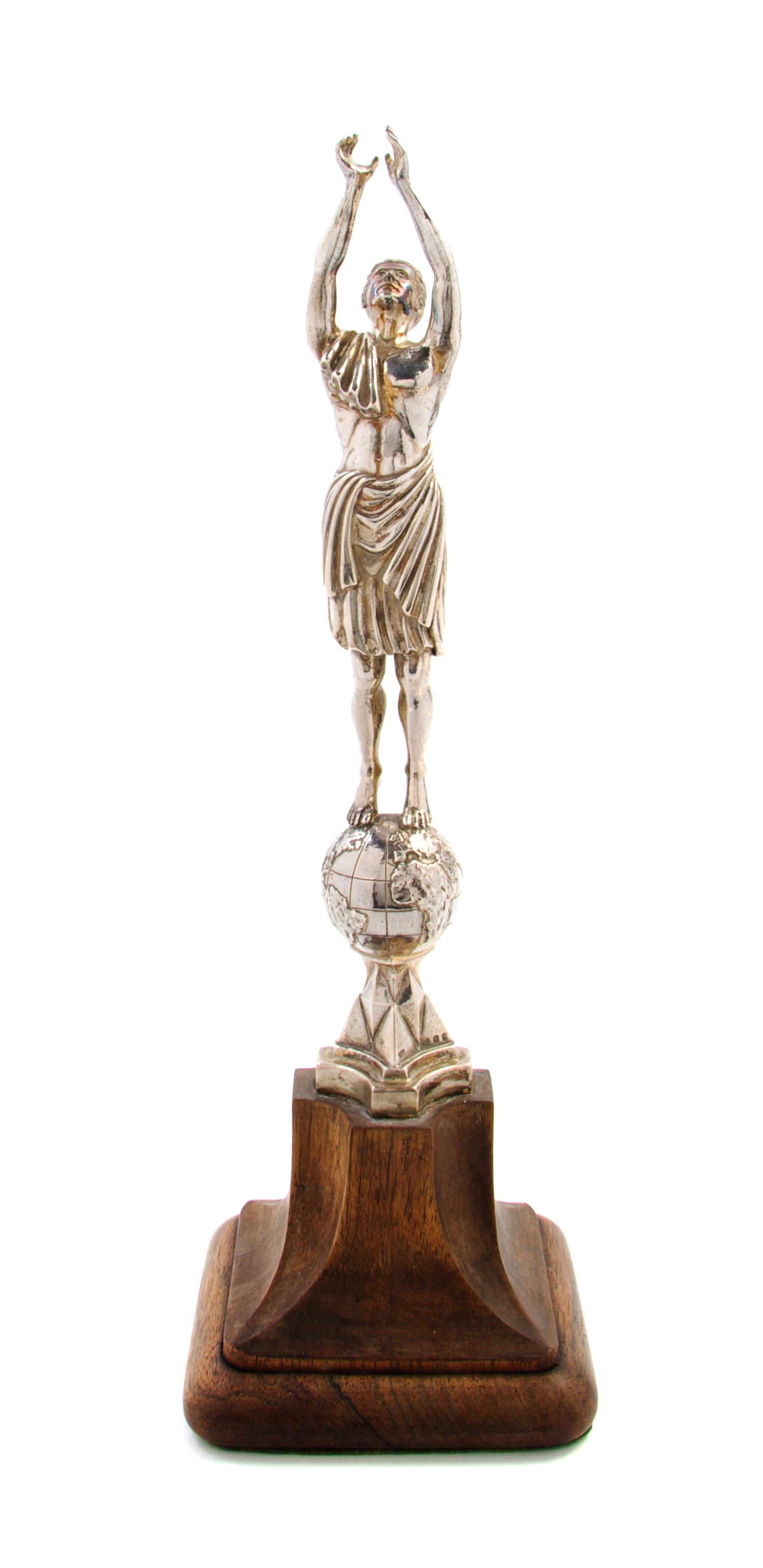 A George V Silver Ornament, Omar Ramsden, London, 1930, in the form of a classical robed gentleman with arms outstretched over his head