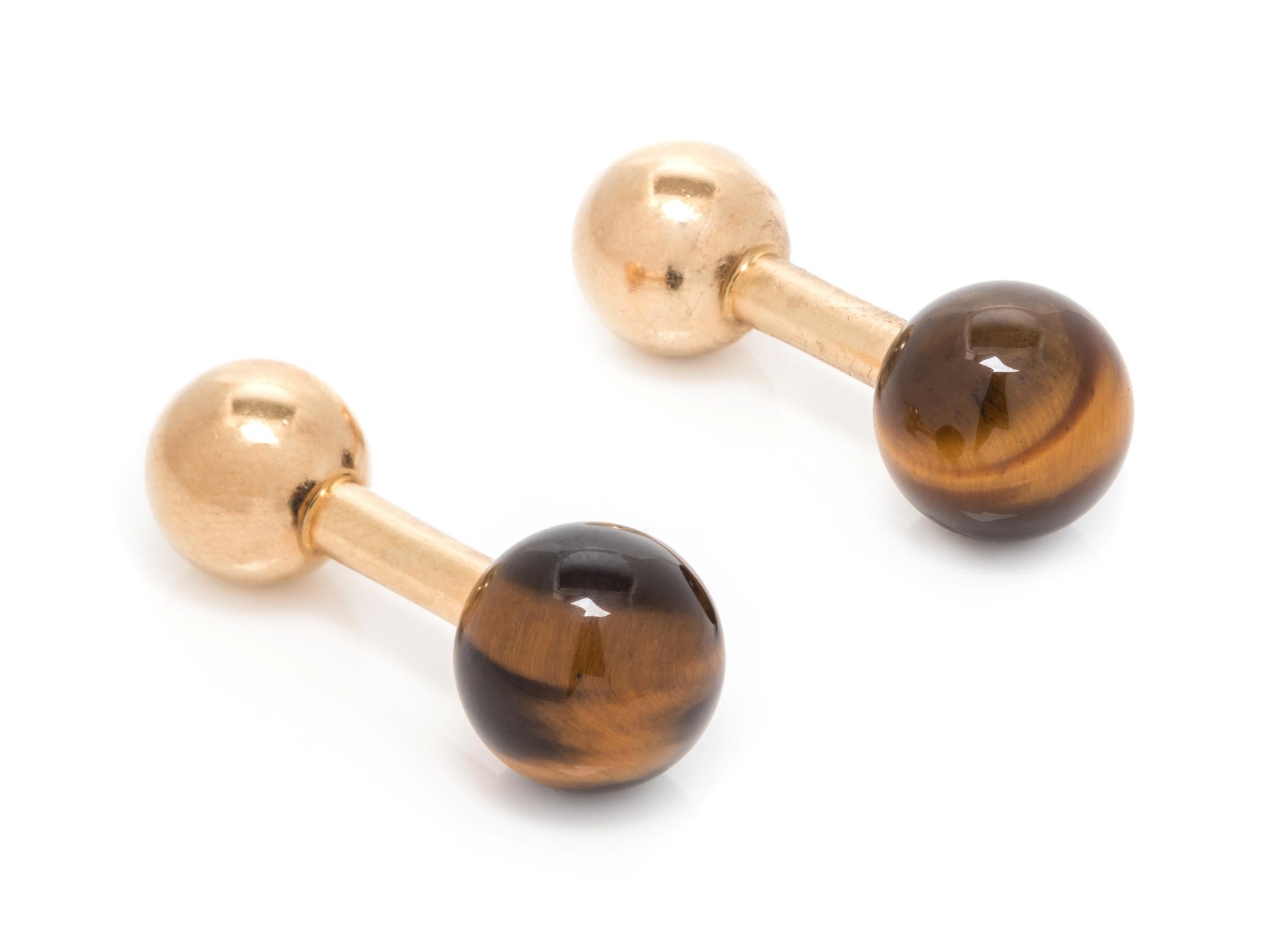 A Pair of 14 Karat Yellow Gold and Tiger's Eye Barbell Cufflinks, Tiffany & Co., 5.00 dwts.