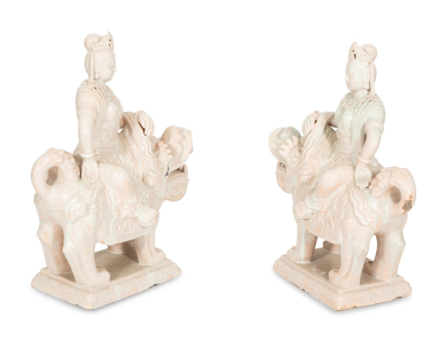 A Pair of Chinese Glazed Ceramic Figures of Guan Yin Atop a Foo Dog