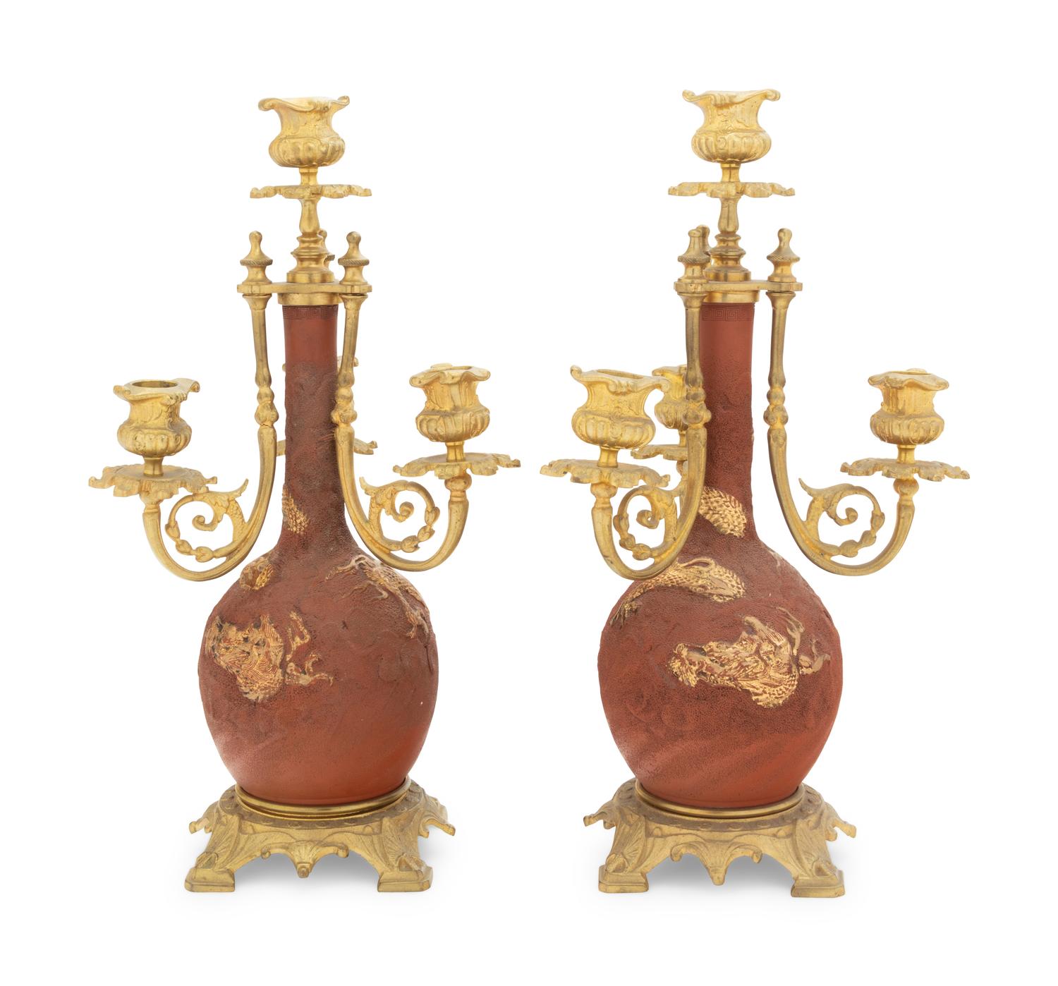 A Pair of Japanese Gilt Bronze Mounted Parcel Gilt Ceramic Four-Light Candelabra