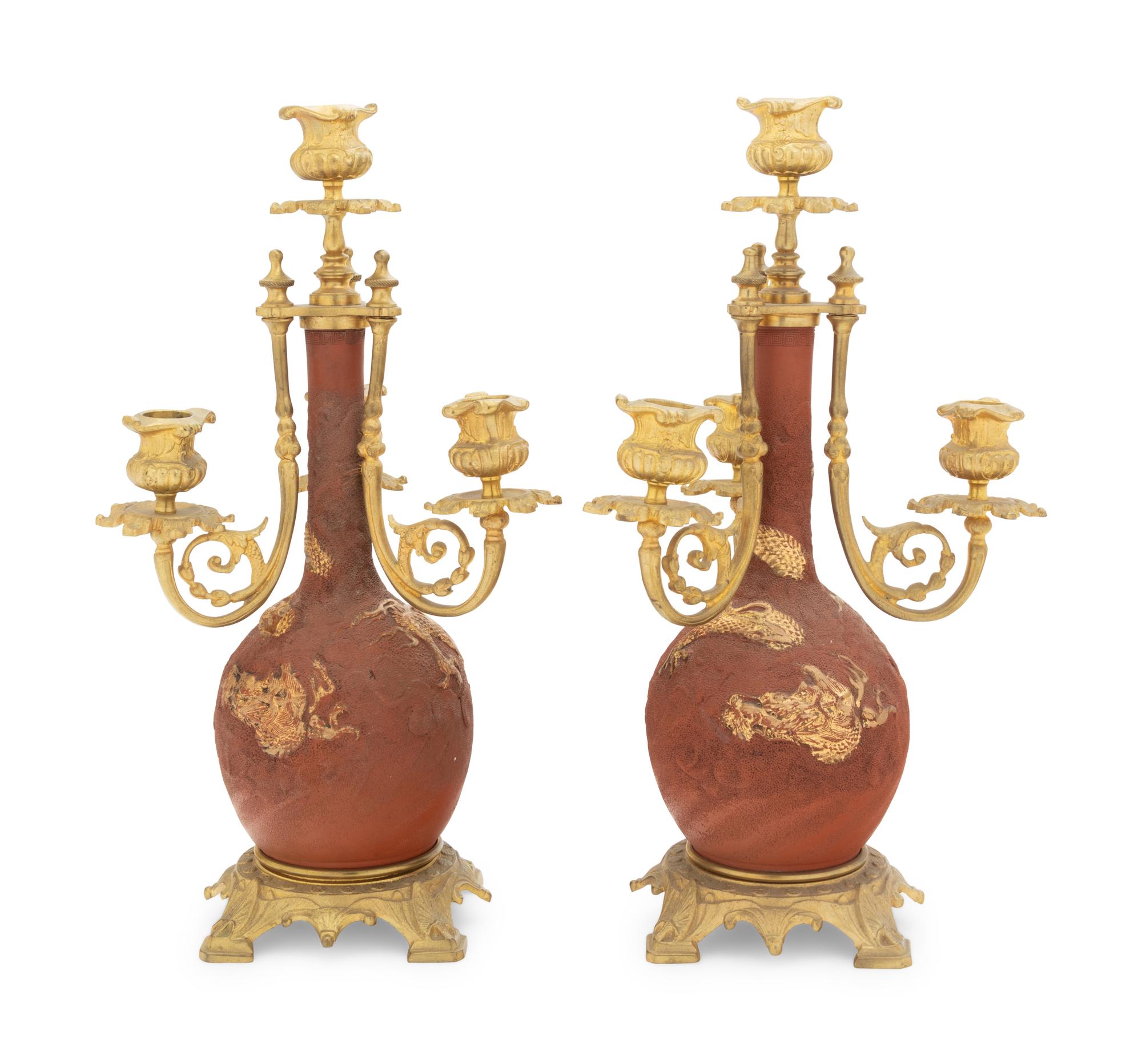 A Pair of Japanese Gilt Bronze Mounted Parcel Gilt Ceramic Four-Light Candelabra
