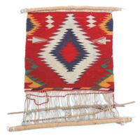 Three Navajo Weavings on Looms Height of largest loom 27 x width 43 3/4 inches.