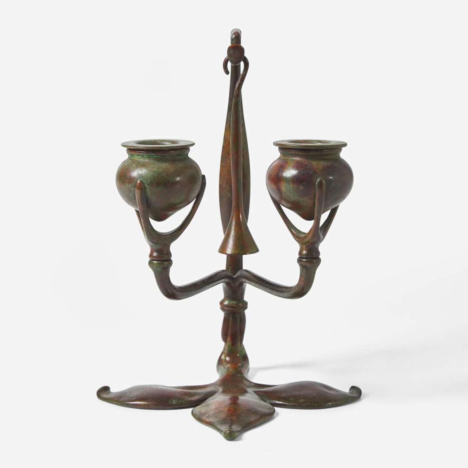 Tiffany Studios (American, active 1878-1932) A Bronze "Fleur de Lis" Two-Light Candelabra with Snuffer, USA, circa 1910