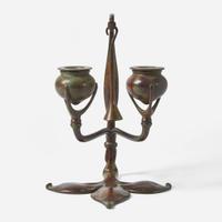 Tiffany Studios (American, active 1878-1932) A Bronze "Fleur de Lis" Two-Light Candelabra with Snuffer, USA, circa 1910