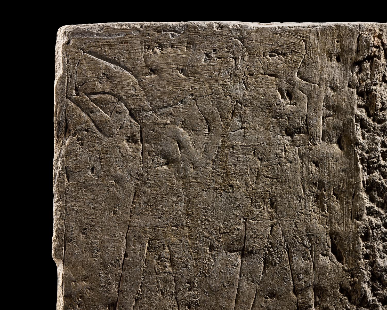 An Egyptian Limestone Relief Fragment Depicting an Offering Scene