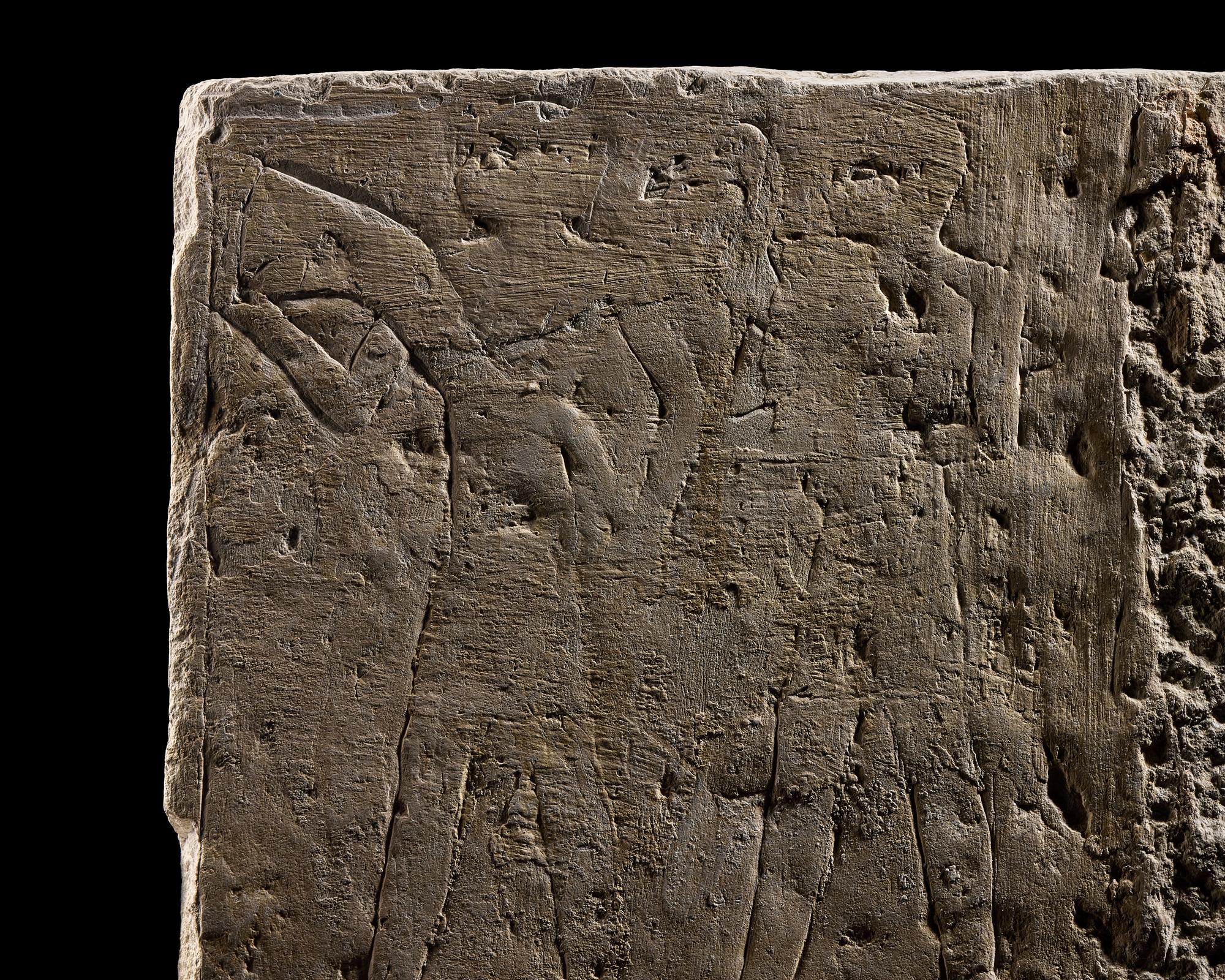 An Egyptian Limestone Relief Fragment Depicting an Offering Scene