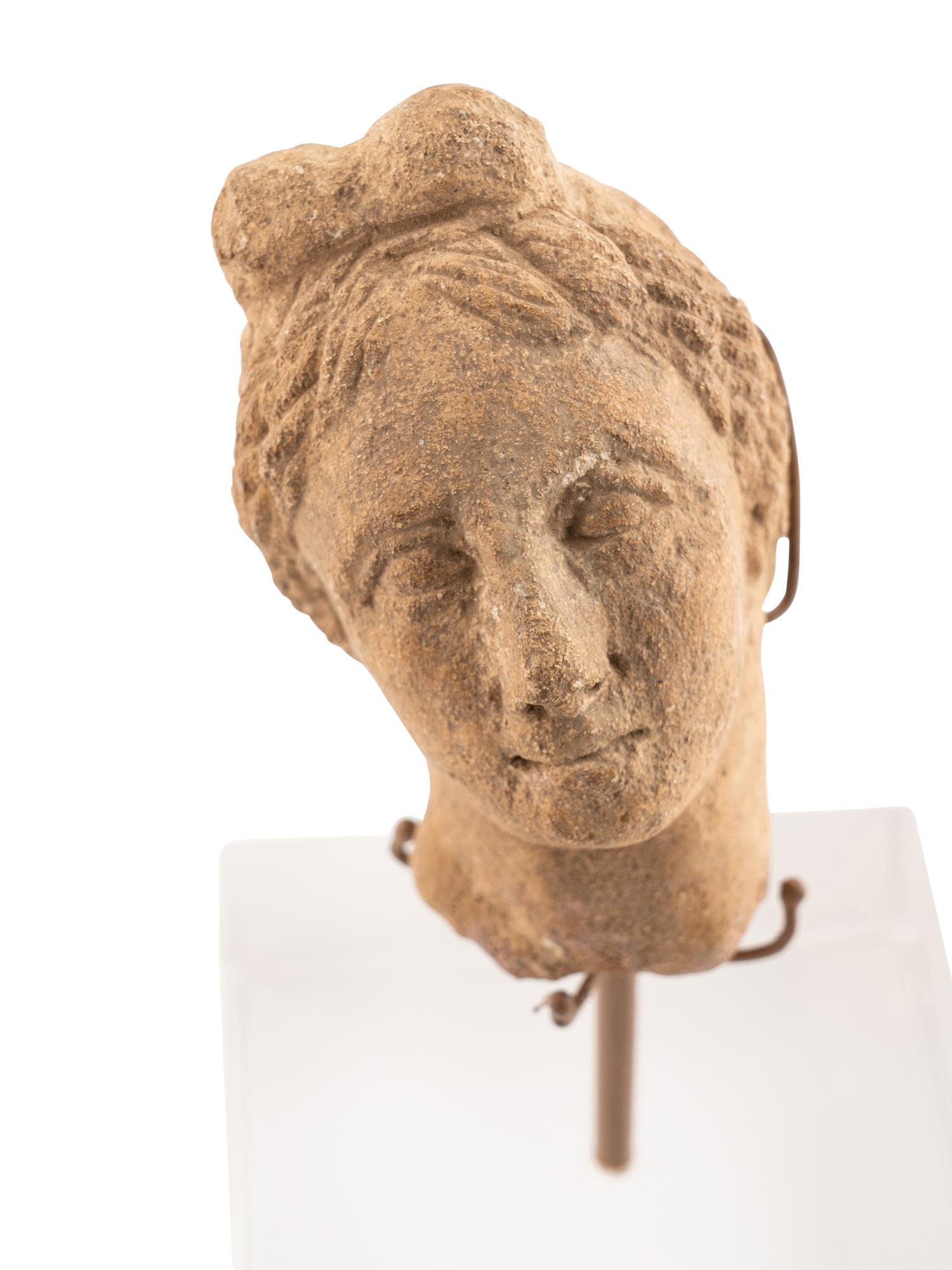 A Roman Stone Head of a Woman