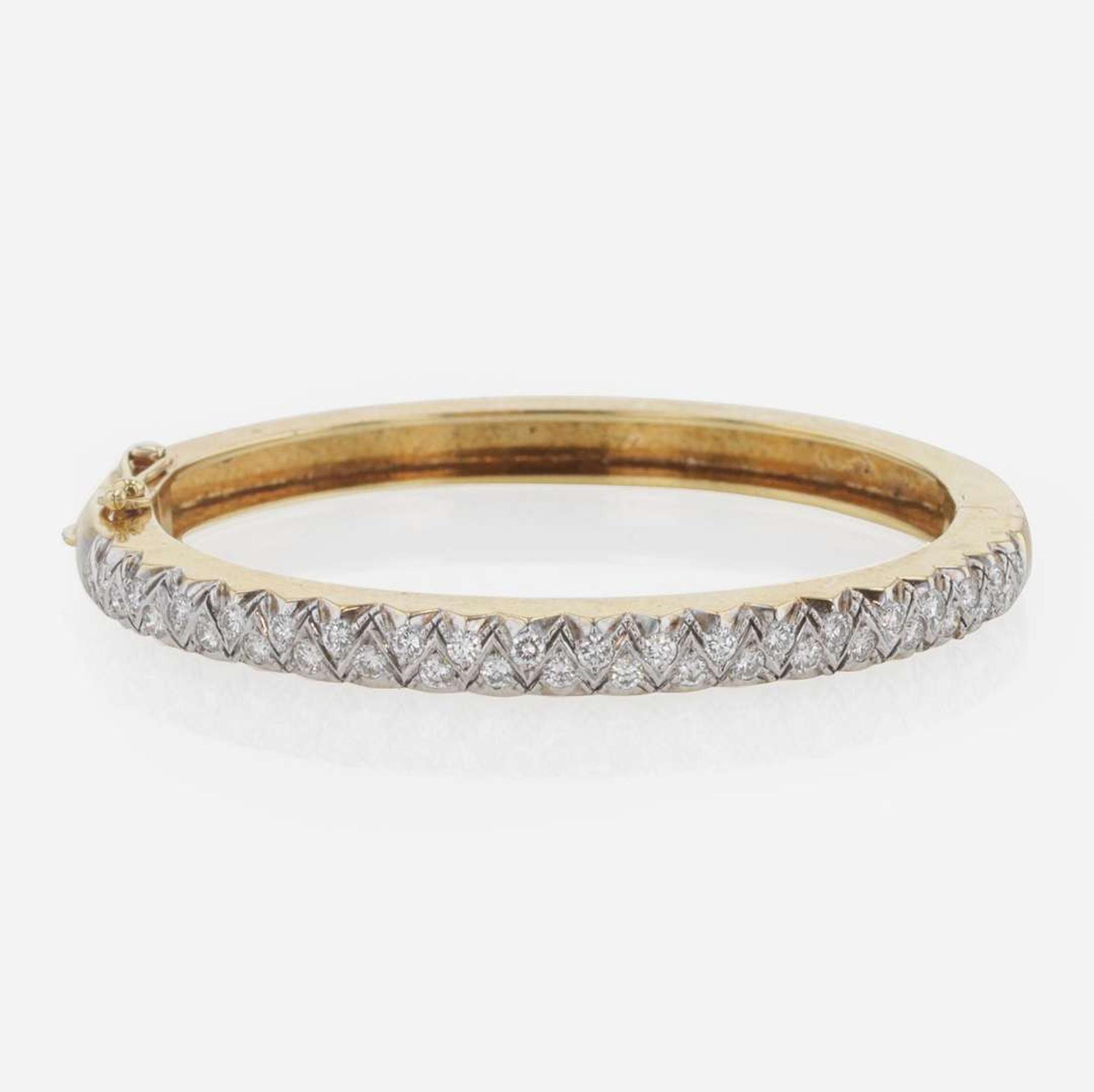 An 18K Gold and Diamond Bangle Bracelet by Carl D. Lindstrom & Sons