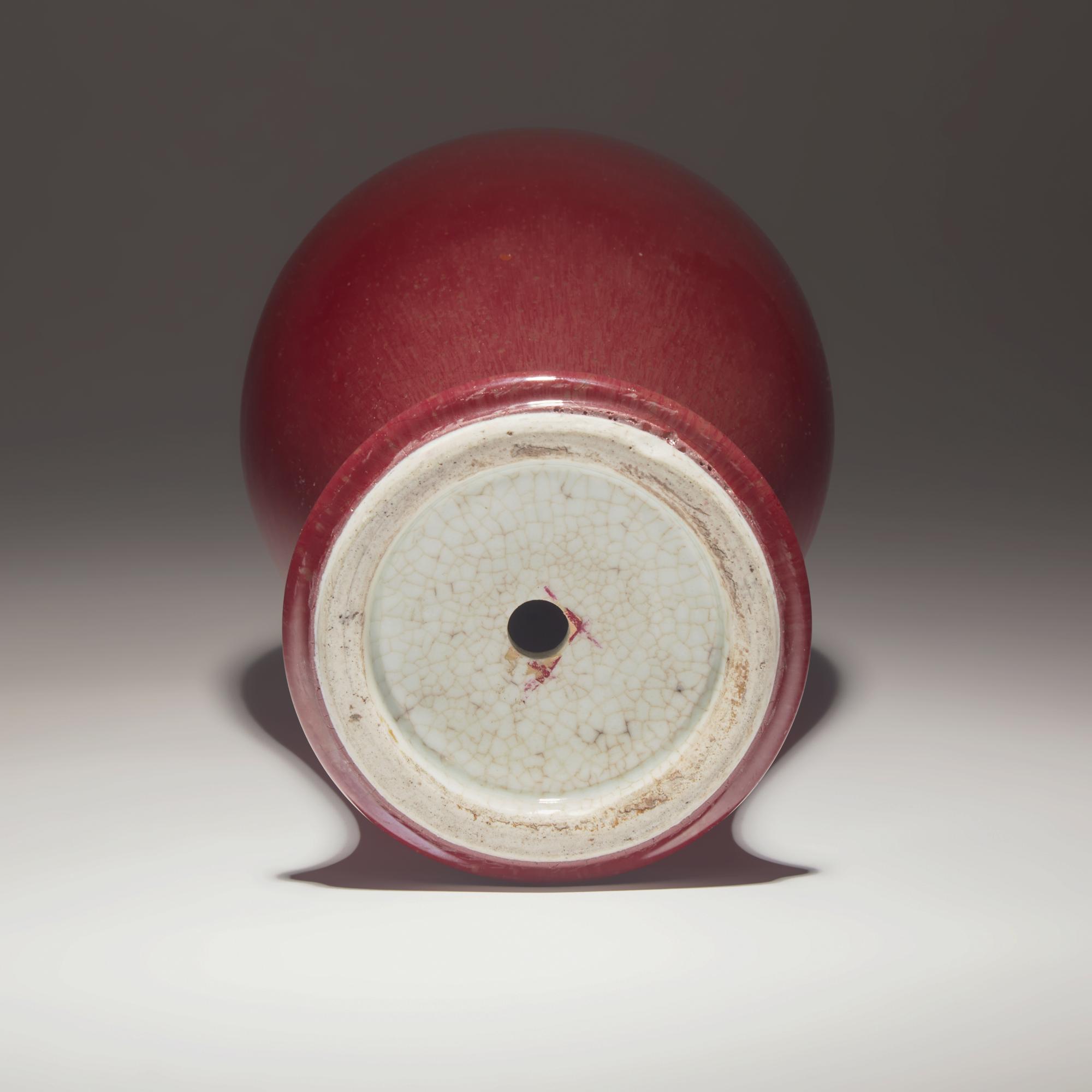 A Chinese Copper Red Glazed Porcelain Vase, 18th/19th Century — 清中期 紅釉觀音瓶