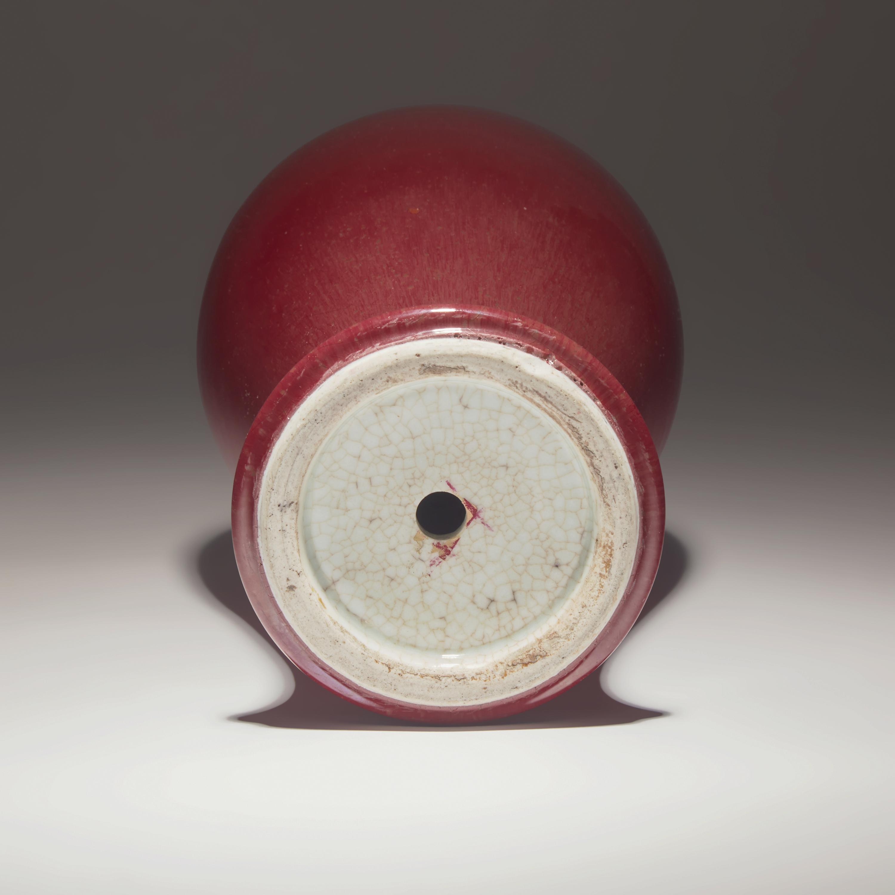 A Chinese Copper Red Glazed Porcelain Vase, 18th/19th Century — 清中期 紅釉觀音瓶