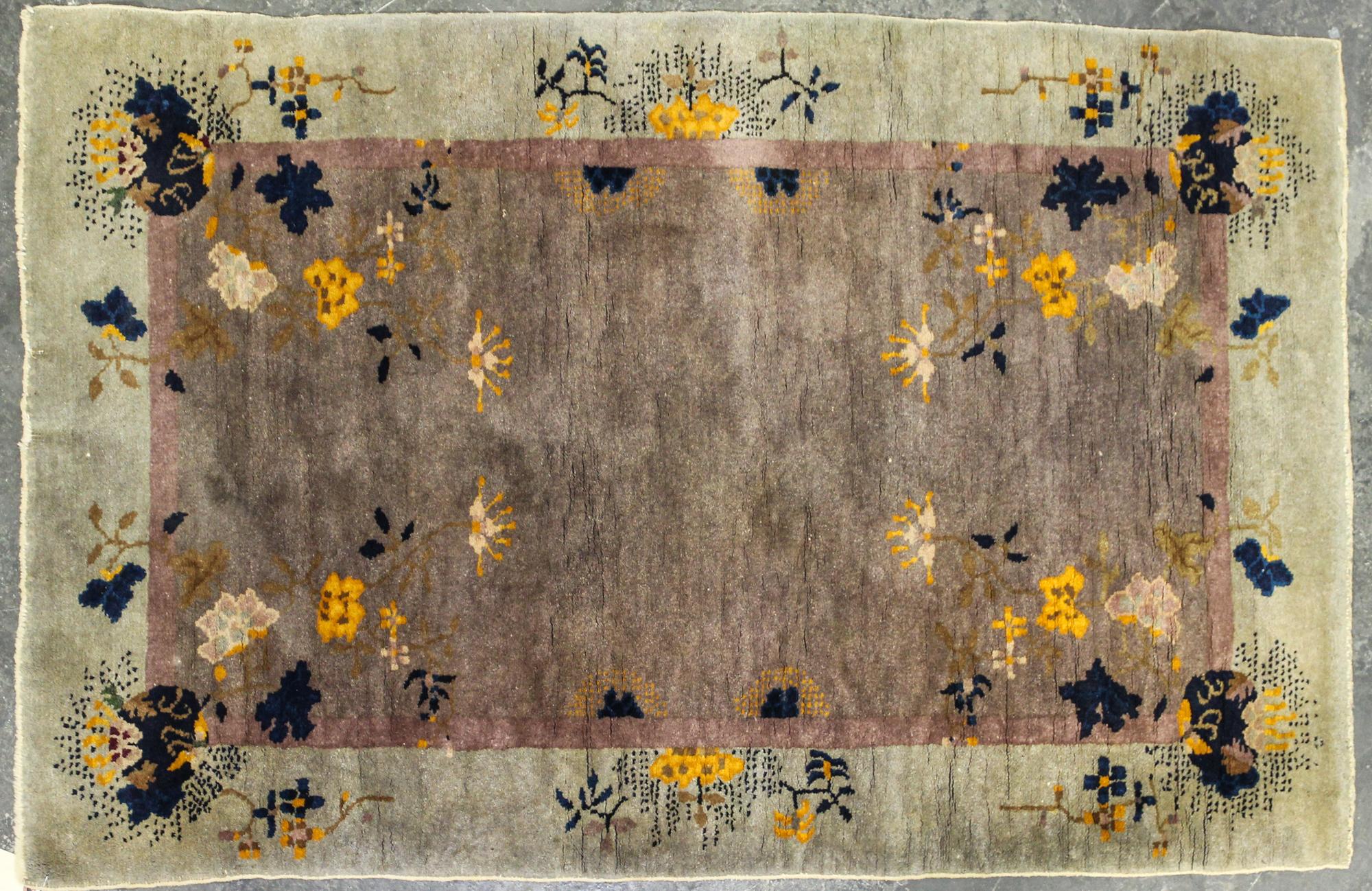 A Chinese Wool Rug 4 feet 10 inches x 3 feet 1 inch. — 1ST HALF 20TH CENTURY