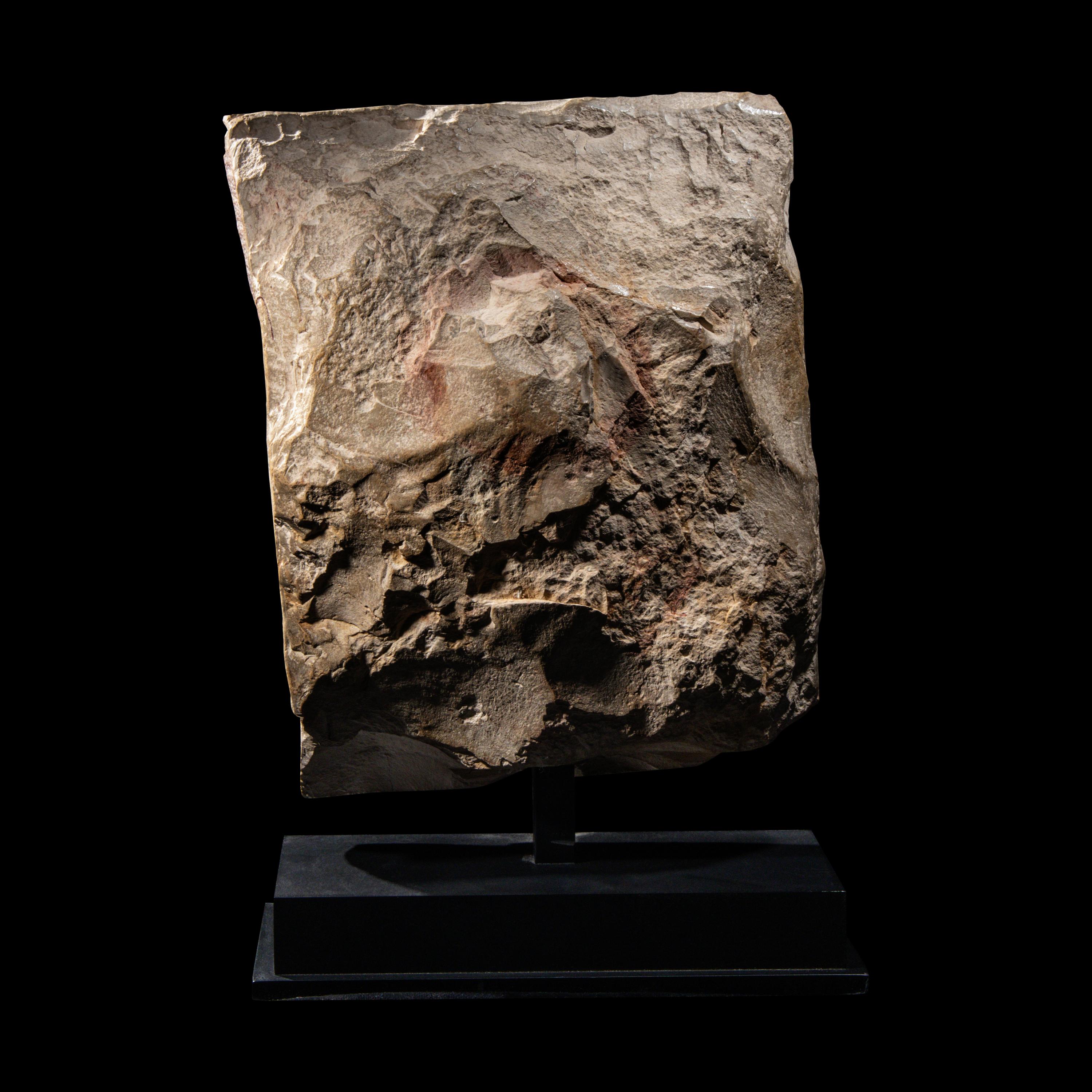 An Egyptian Limestone Relief Fragment with a Priest