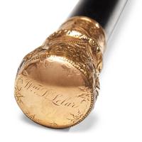 A Presentation Ebonized Wood Walking Stick with Gold-Plated Mount