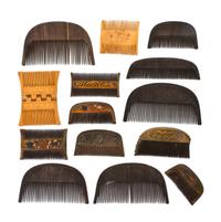 Fourteen Middle Eastern Carved Wood Hair Combs, Width of longest 5 7/8 inches.