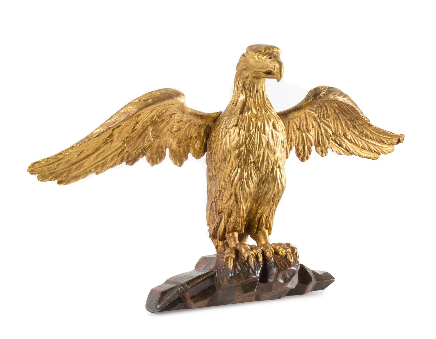 A Carved Giltwood Eagle Height 15 1/2 x width 26 inches. — 19TH CENTURY
