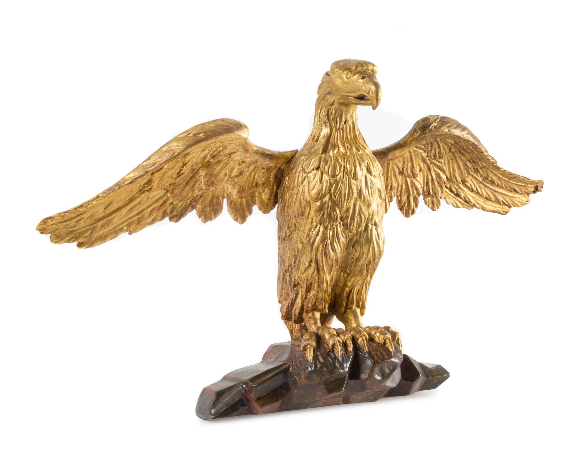 A Carved Giltwood Eagle Height 15 1/2 x width 26 inches. — 19TH CENTURY