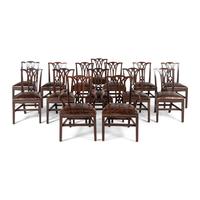 A Set of Fourteen English Mahogany Dining Chairs