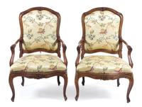 A Pair of Louis XV Walnut Fauteuils Height 41 1/2 inches. — 18TH CENTURY