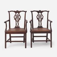 A pair of Chippendale style carved mahogany armchairs late 19th / early 20th century