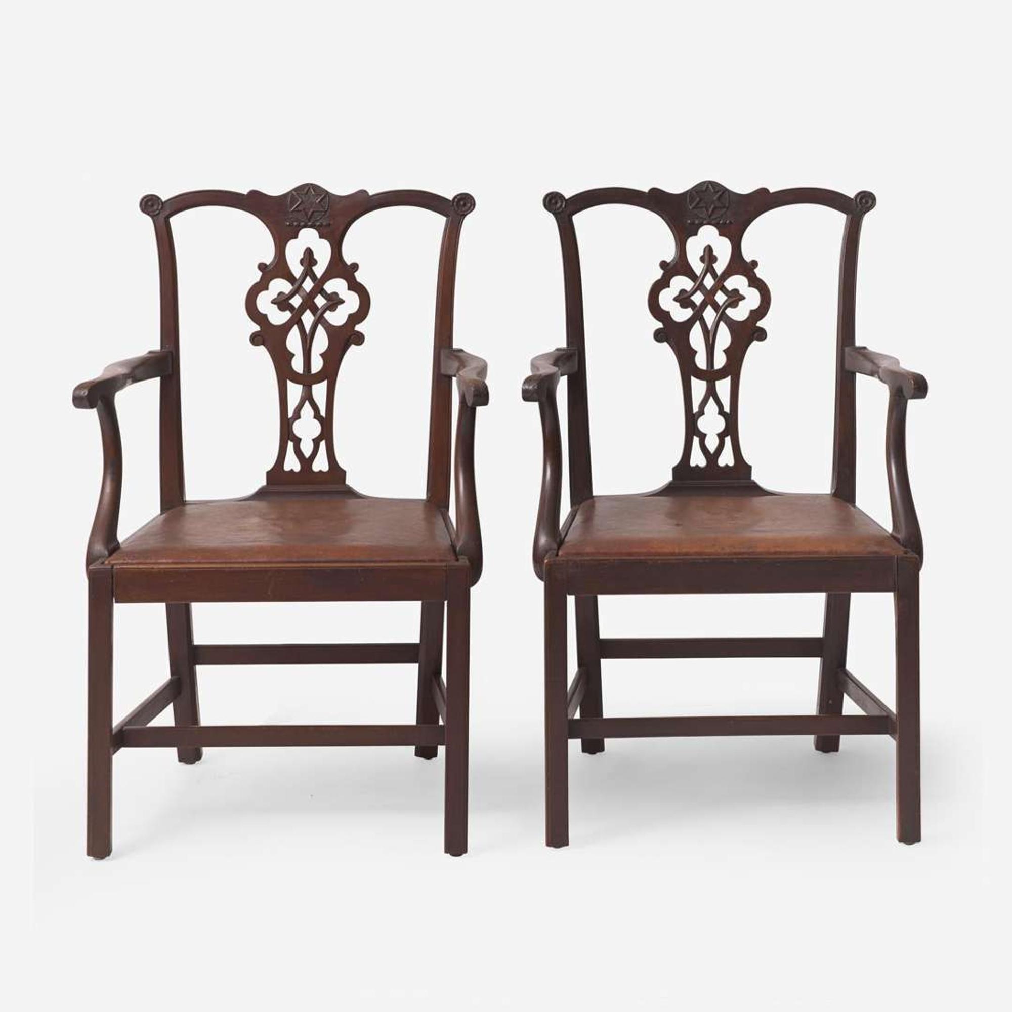 A pair of Chippendale style carved mahogany armchairs late 19th / early 20th century