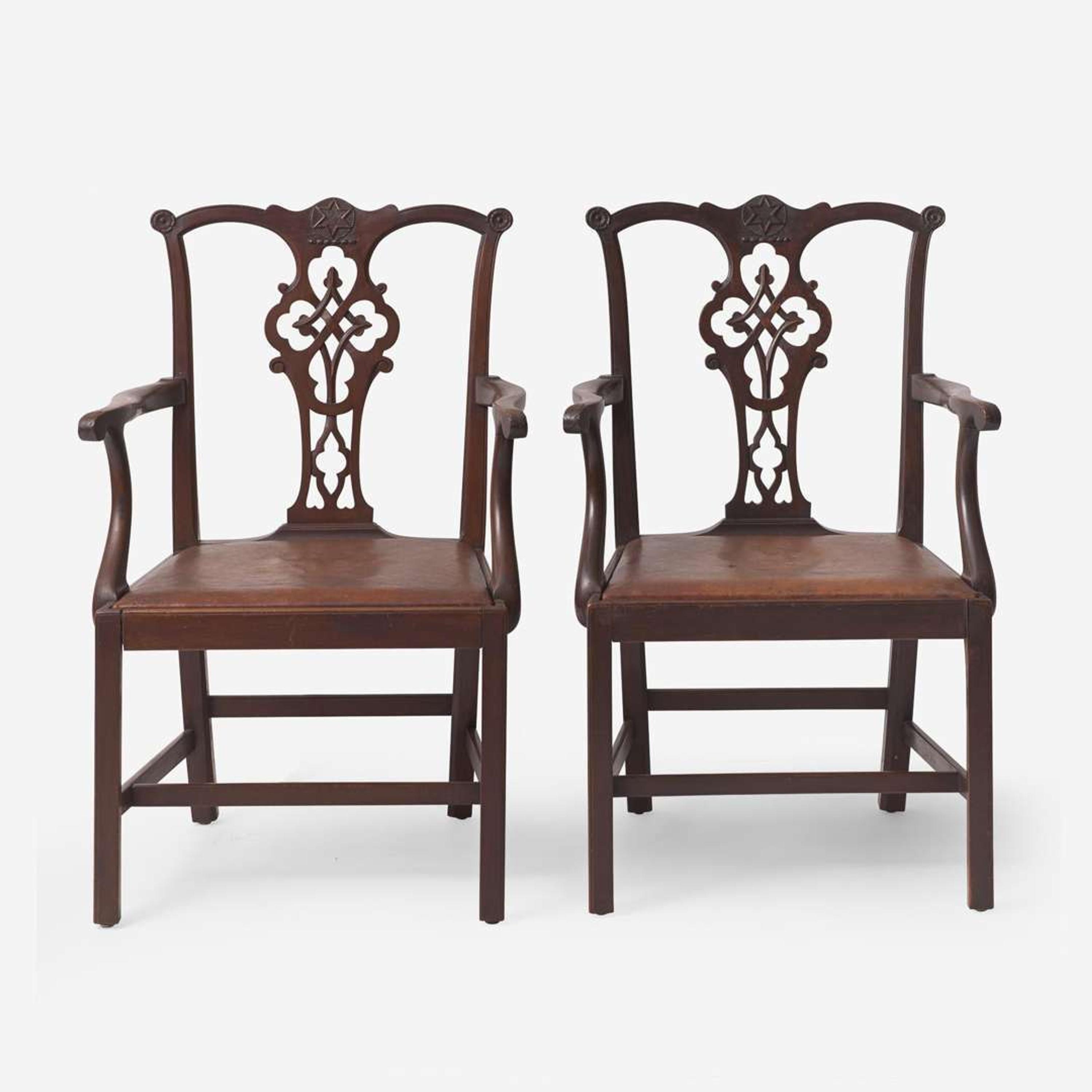 A pair of Chippendale style carved mahogany armchairs late 19th / early 20th century