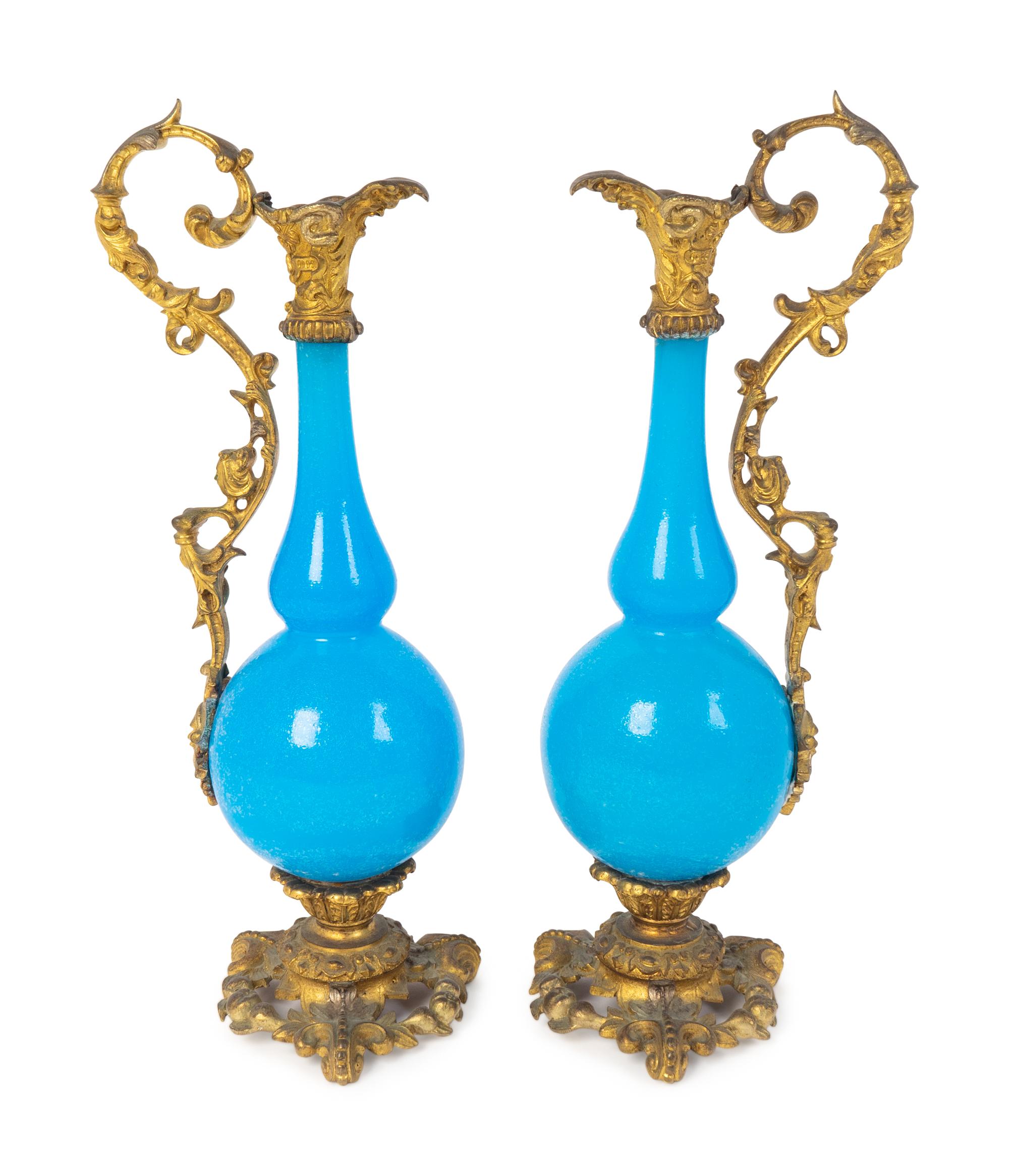 A Pair of Gilt Bronze Mounted Blue Opaline Glass Ewers — LATE 19TH CENTURY