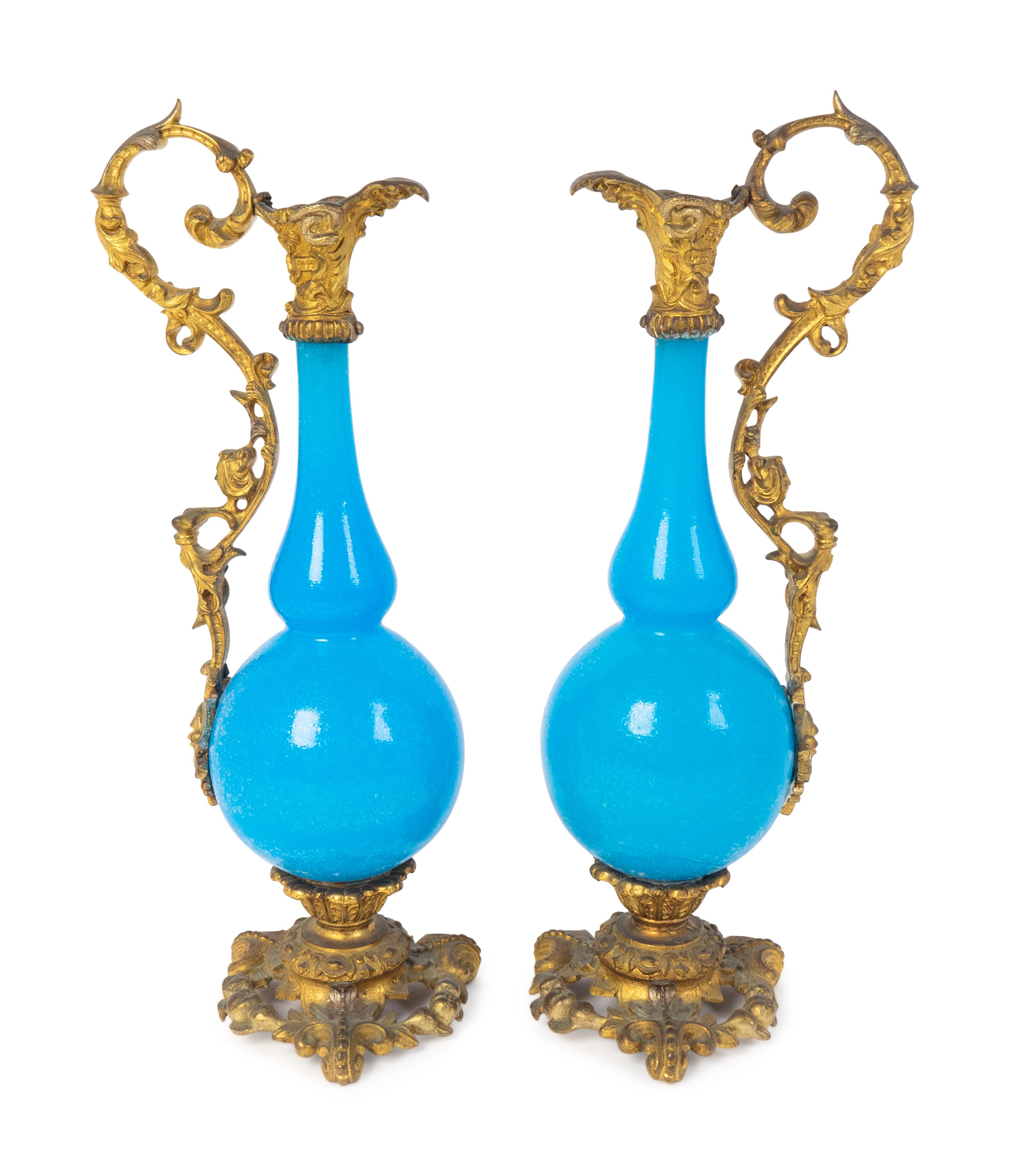 A Pair of Gilt Bronze Mounted Blue Opaline Glass Ewers — LATE 19TH CENTURY
