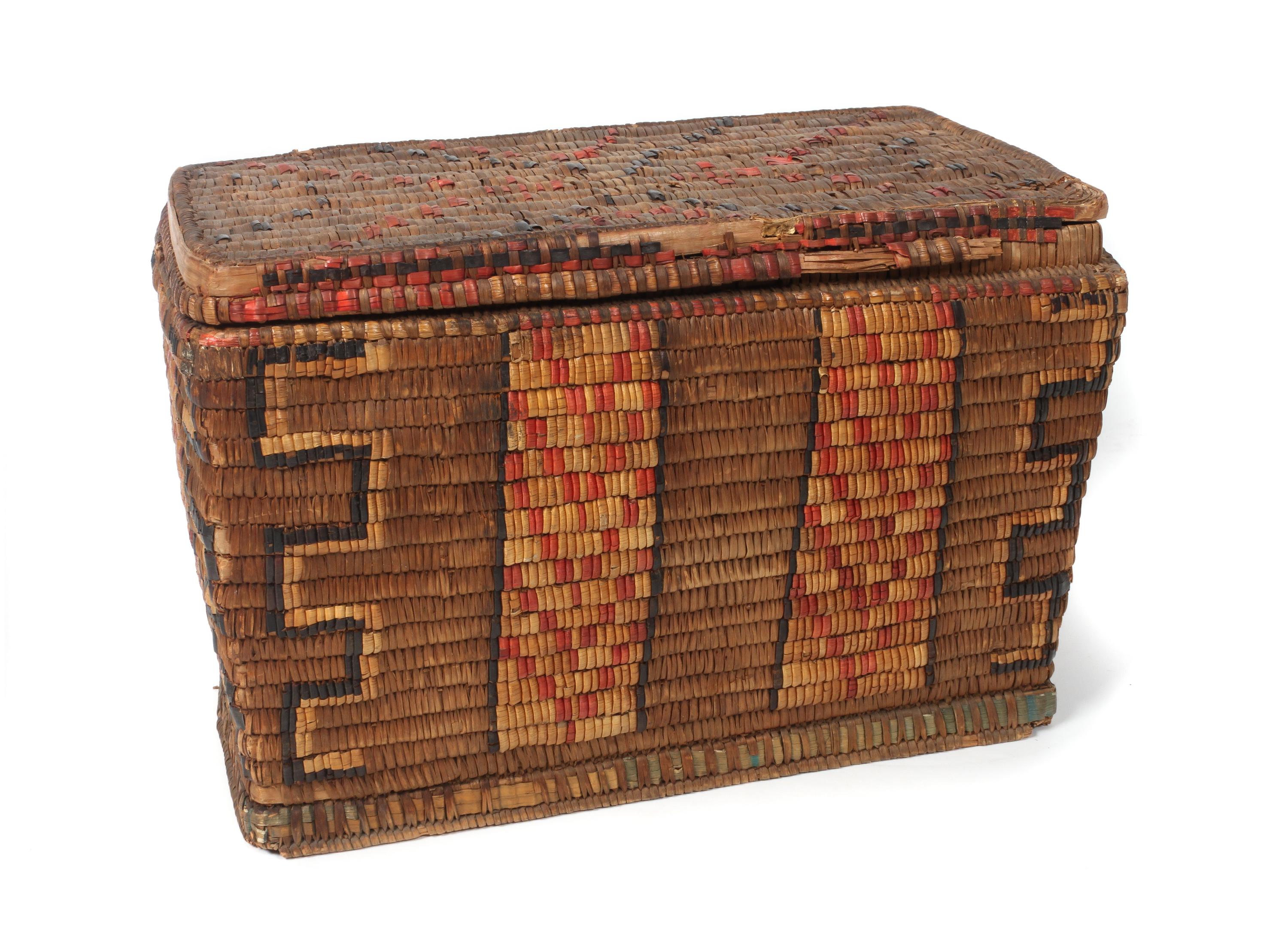 A Salish Cedar Basket Trunk Height 11 1/2 x width 18 x depth 10 1/2 inches.